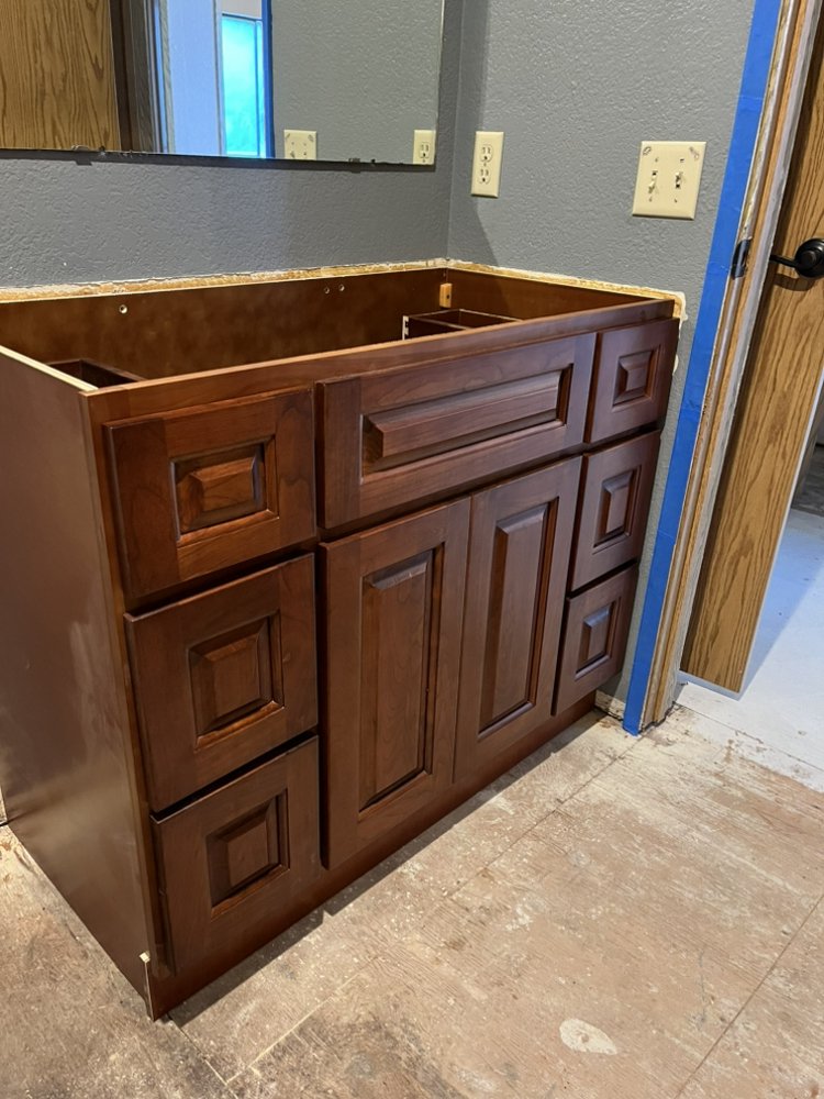 Dark walnut bathroom vanity cabinet installation