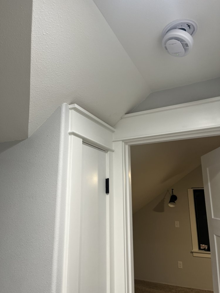 Crown moulding detail at ceiling junction — clean mitered corners